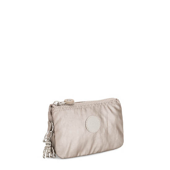 Plecaki Kipling Creativity Small Metallic Pouch Beżowe | PL 1107OK